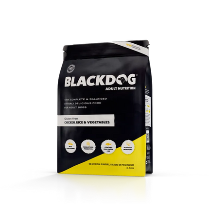 Black dog adult food with chicken, rice, and vegetables from Macaw and Friends, showing a bowl of balanced dog meal.