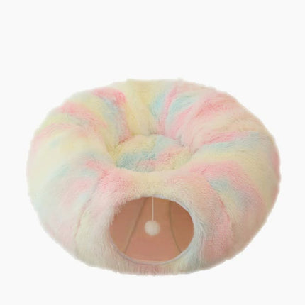 Rainbow plush cat bed with hidden tunnel by Macaw And Friends, soft round pet bed for cats and small dogs, cozy and colorful.