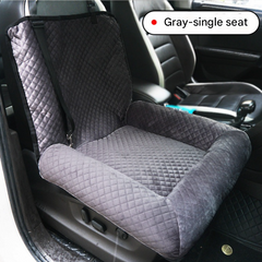 Grey plush dog car booster seat by Macaw And Friends, with washable cover, designed for small dogs as a travel bed and carrier.