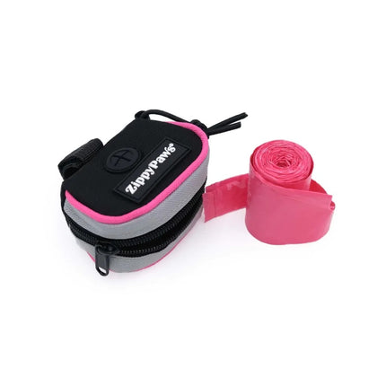 Green Zippy Paws Adventure Leash Dog Poop Bag Dispenser with bonus roll from Macaw And Friends, attached to a pink leash.