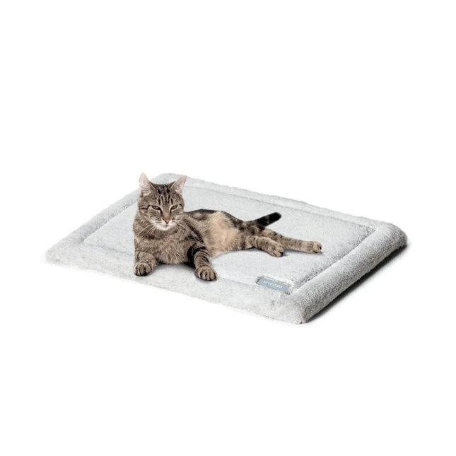 Self-warming cat mat by Macaw And Friends, soft pet bed with thermal lining for cozy comfort for cats.